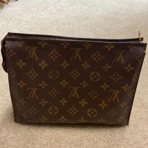 Authentic Loui Vuitton makeup pouch. 9 1/2” wide 7 1/2” long. Like new.No damage